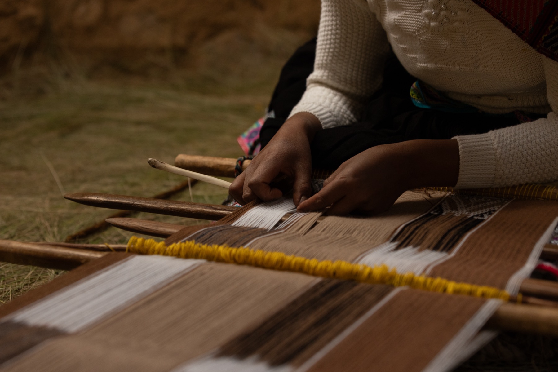 Paulina weaving traditional Q'ero textiles